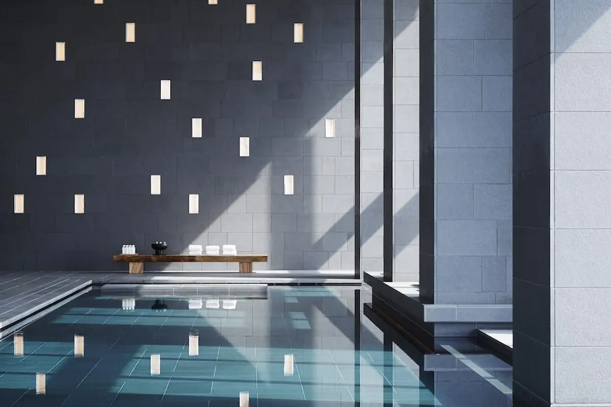 Aman Tokyo Review: Is the Otemachi Tower Icon Still Worth It in 2026?, Onsen style bathing pool in the spa with stone walls
