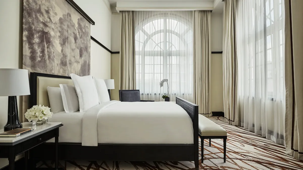 Governor Suite bedroom at Four Seasons Mexico City with oversized arched windows