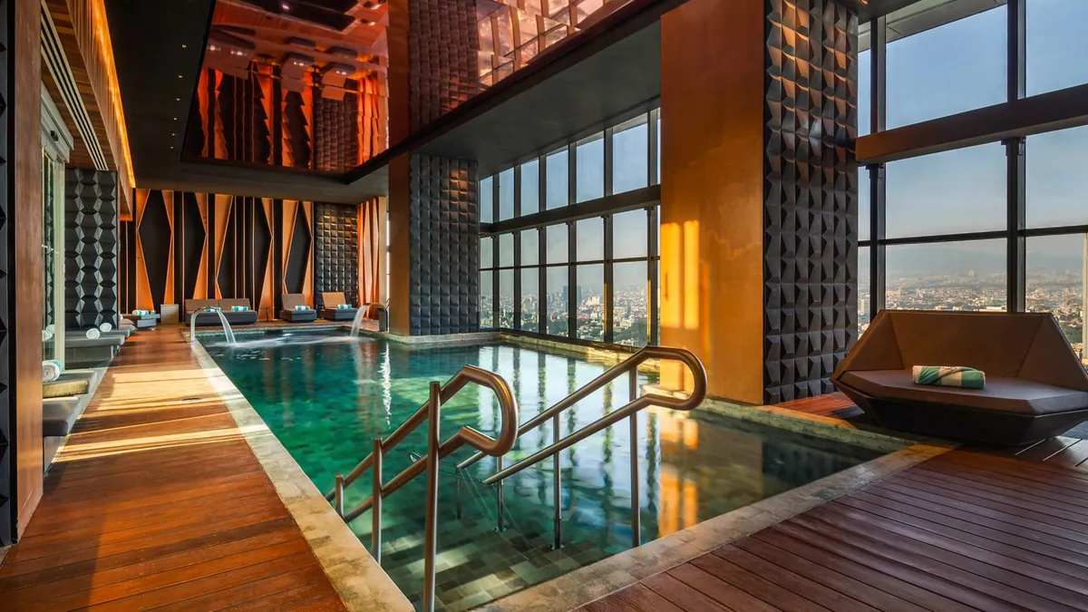 Thirty eighth floor rooftop saltwater pool at Sofitel Mexico City Reforma with a panoramic skyline view