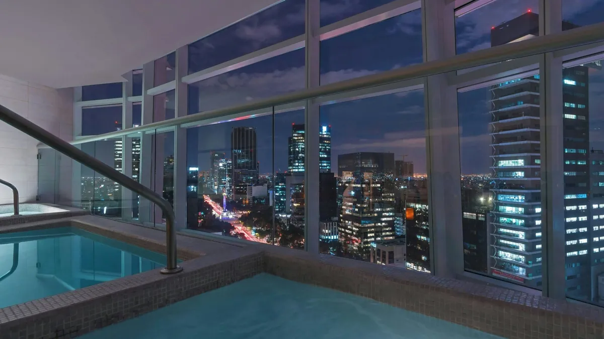 Indoor pool at The St. Regis Mexico City with a Reforma city view