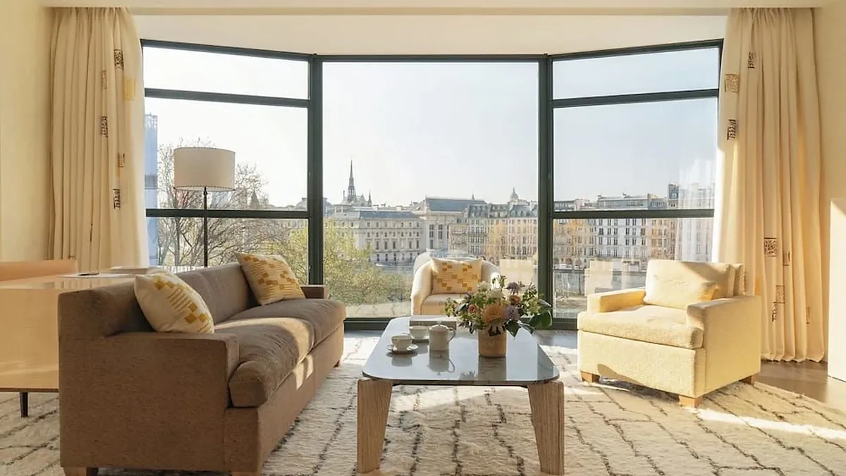Seine view suite at Cheval Blanc Paris with floor to ceiling windows over the Pont Neuf