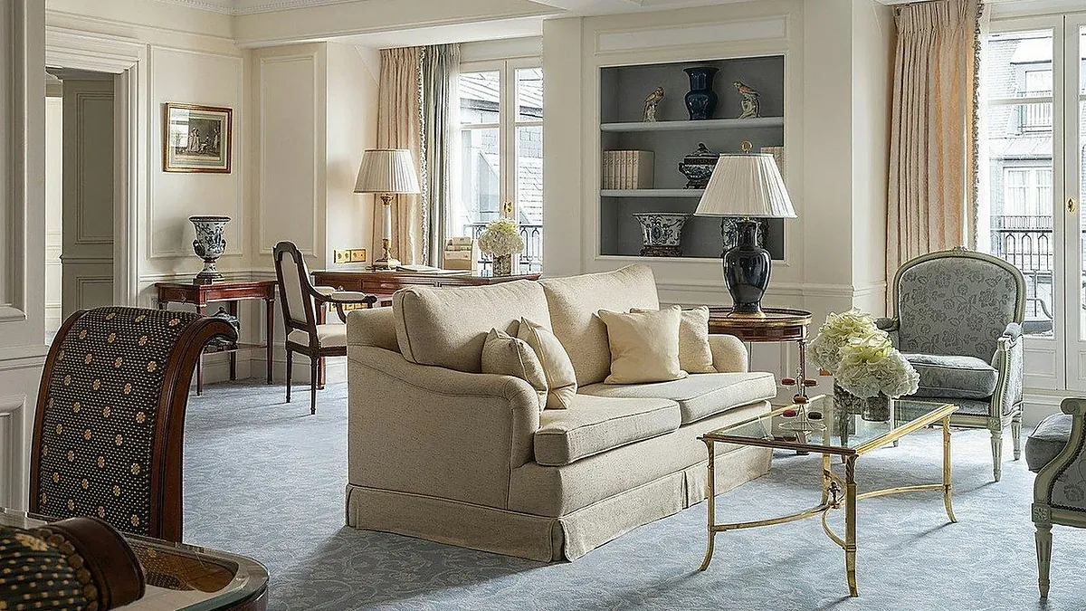 Signature suite salon at Four Seasons Hotel George V Paris with silk upholstery and antique furniture