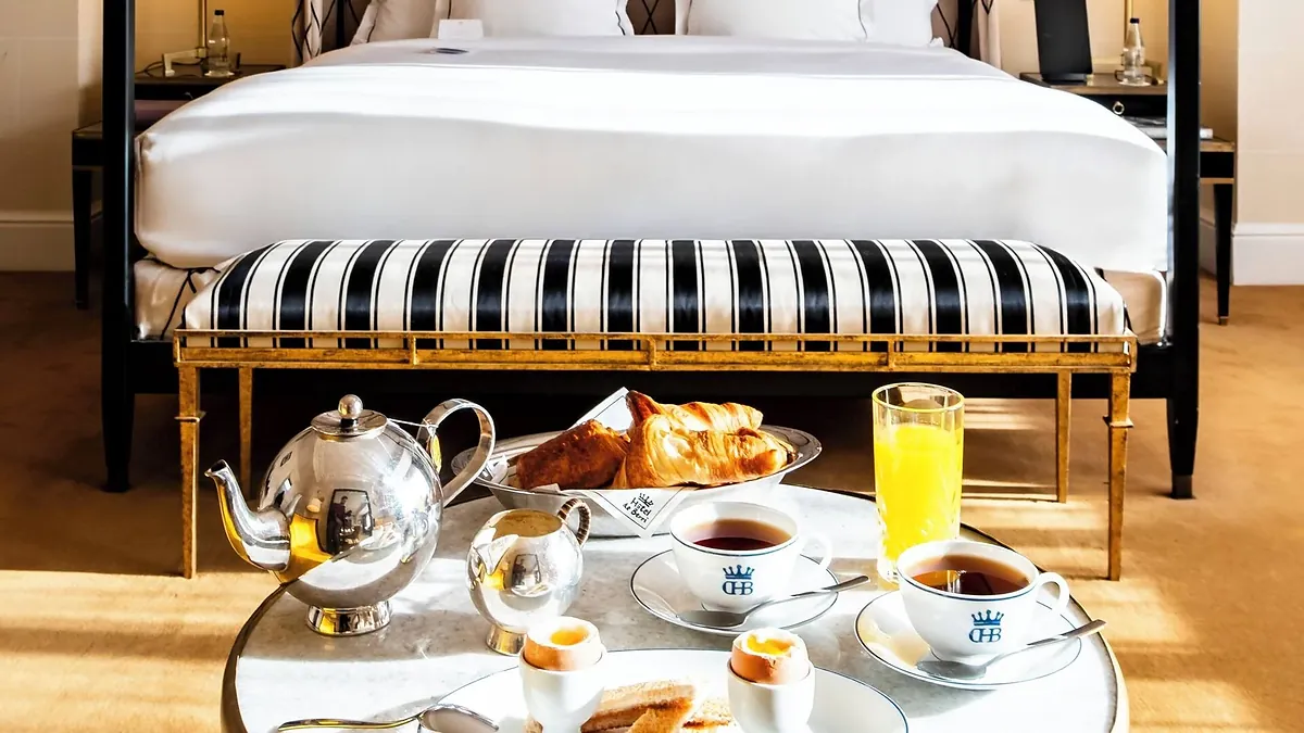 Guest bedroom with breakfast tray at Hôtel de Berri Paris
