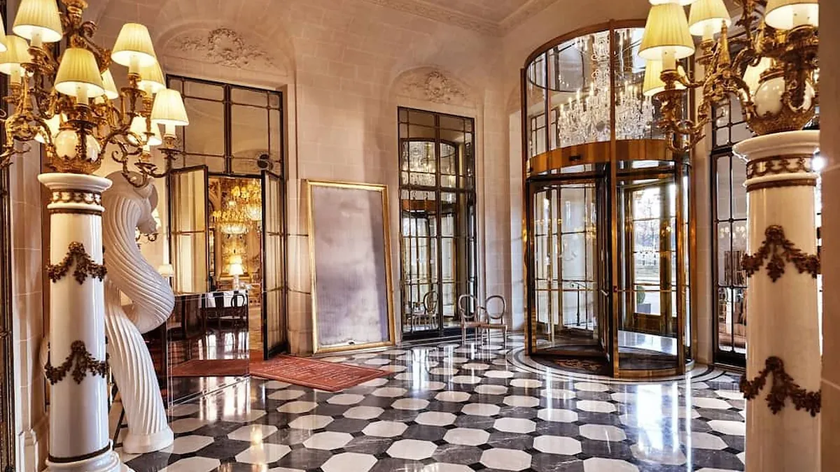 Royal suite bedroom with gilded panelling at Le Meurice Paris