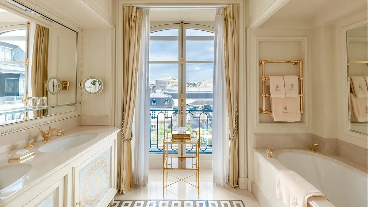 Imperial suite bedroom with gilded bed at the Ritz Paris