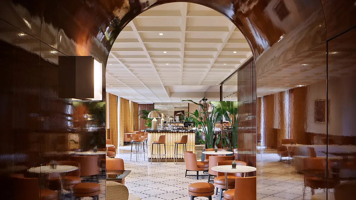 Bulgari Bar at Bulgari Hotel Roma with brass, marble and moody lighting