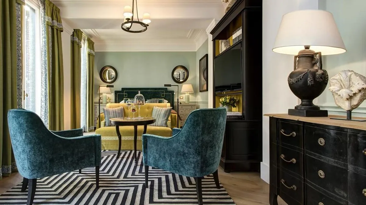 Guest bedroom at Hotel de la Ville Rome with rich fabrics and elegant furnishings
