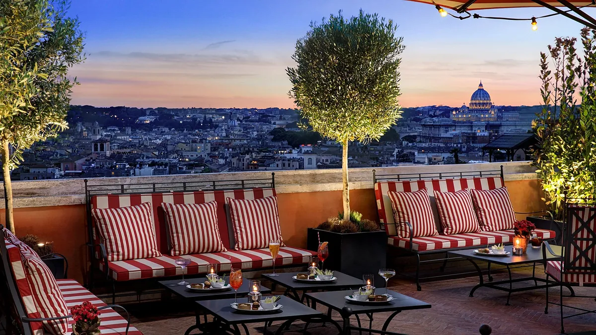 Cielo rooftop terrace at Hotel de la Ville above the Spanish Steps at dusk