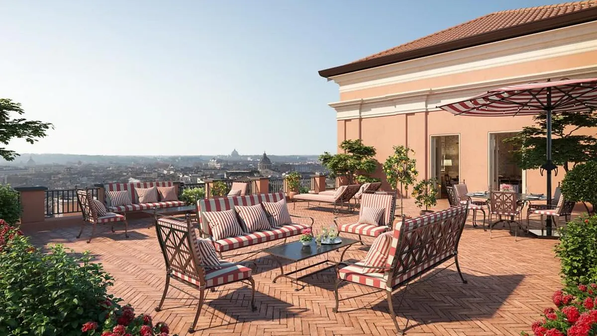 Rooftop terrace at Hotel de la Ville with panoramic views of central Rome