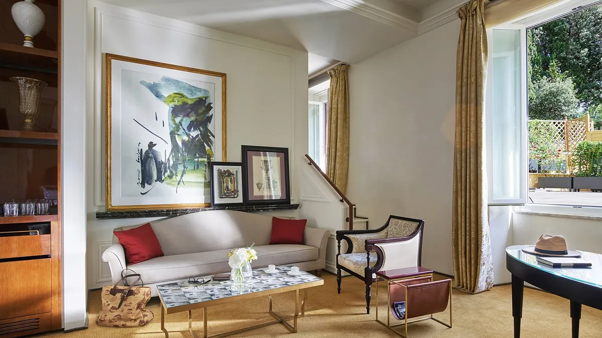 Aurora Terrace Suite living room at Hotel Eden Rome with private terrace and rooftop views