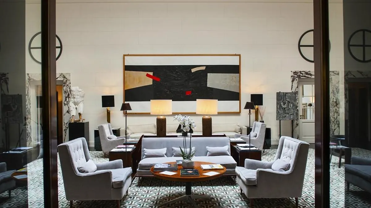 Sitting room at J.K. Place Roma with warm textures and residential feel