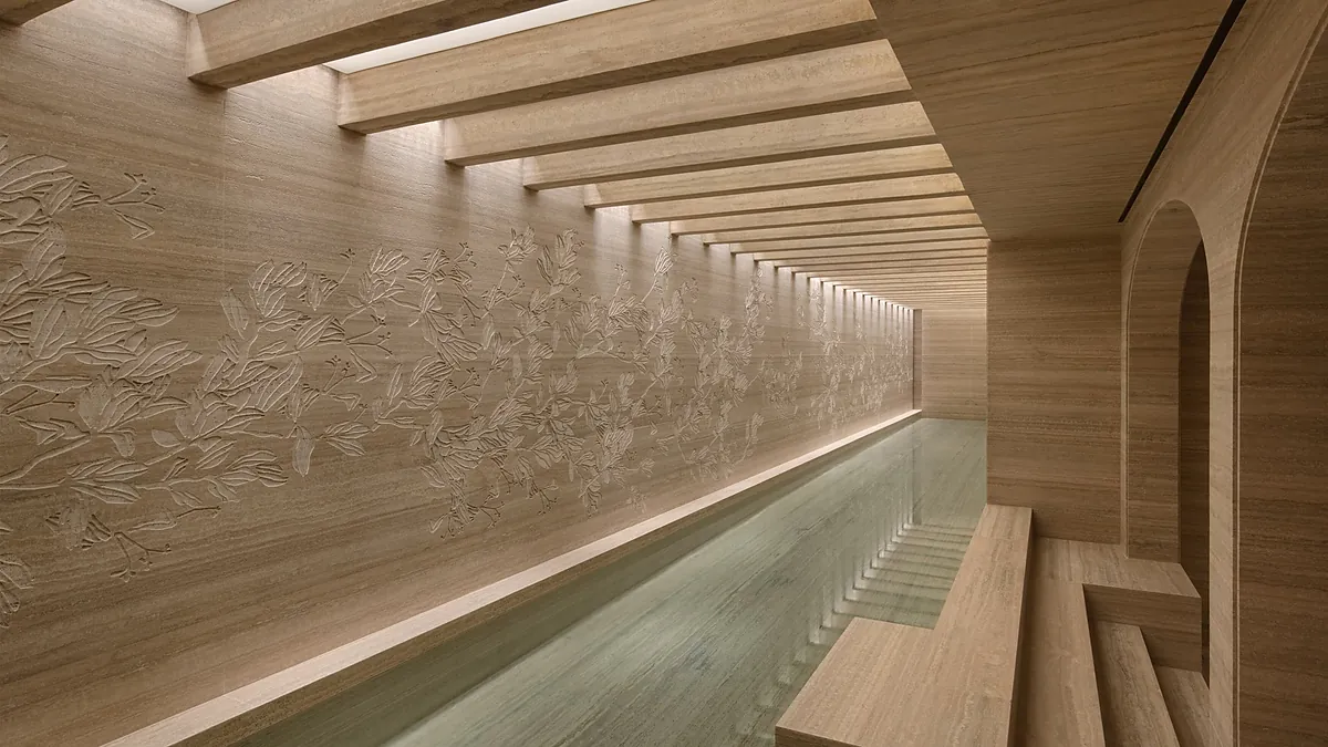 Roman bathhouse tepidarium at Six Senses Rome spa featuring travertine and marble