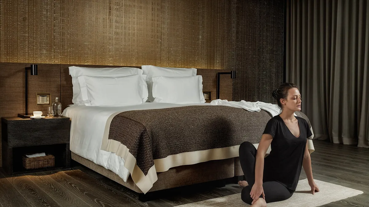 Superior room at Six Senses Rome with high ceilings and sustainable natural materials
