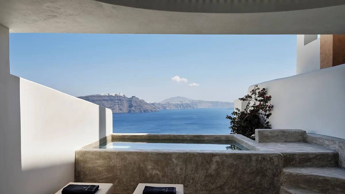 Private terrace and plunge pool at an Andronis Luxury Suites suite overlooking the Santorini caldera