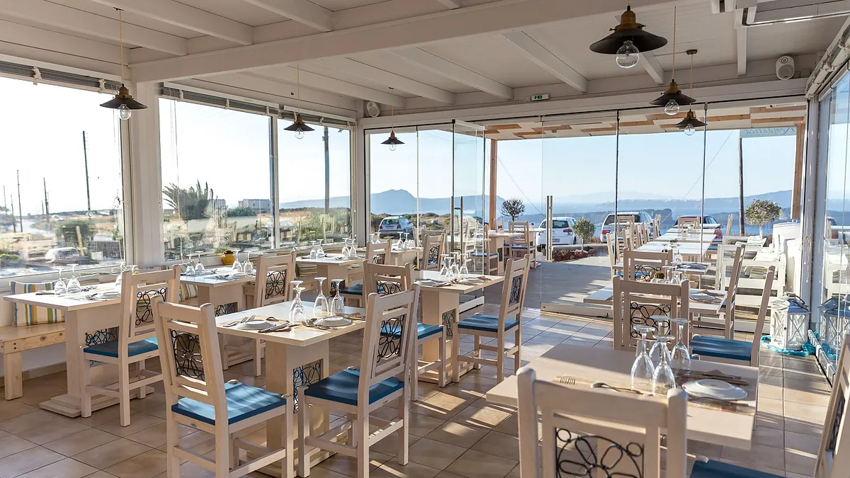 Restaurant large windows caldera at Caldera Romantica in Santorini