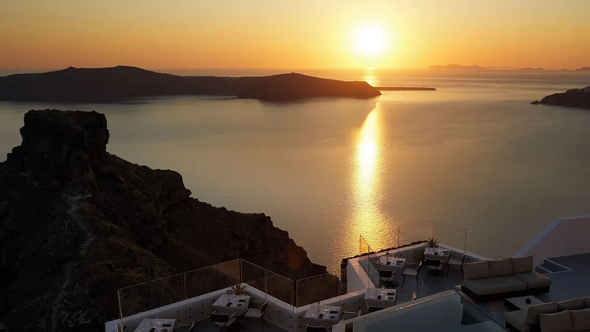 Rooftop terrace sunset sea view at Grace Hotel Santorini in Santorini