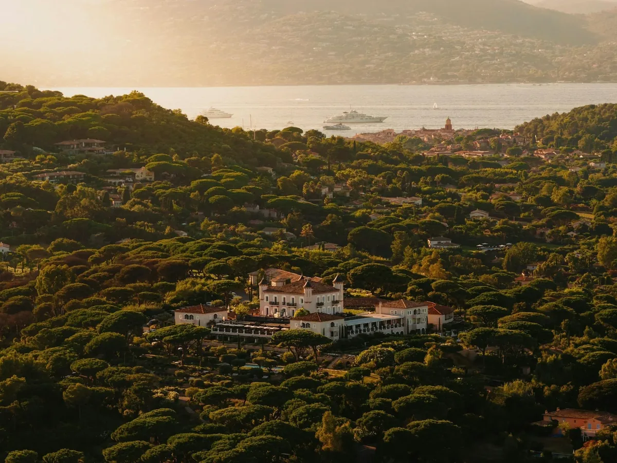 Aerial view of Chateau de la Messardiere above Saint-Tropez at golden hour