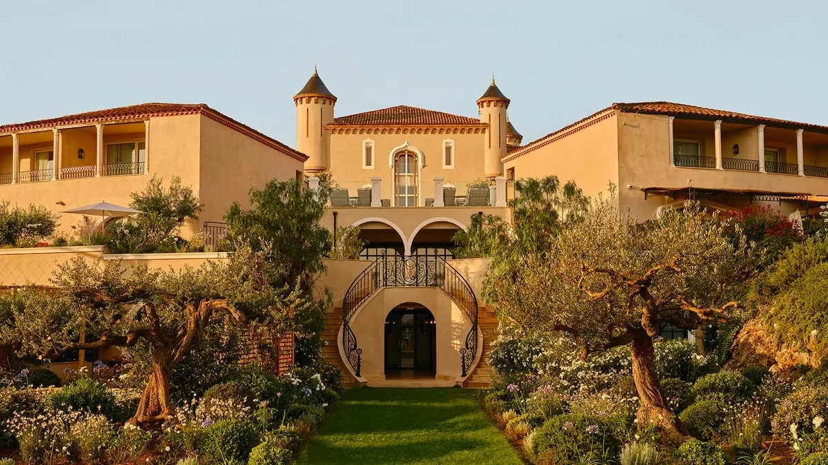 The 19th century chateau facade and Provencal gardens