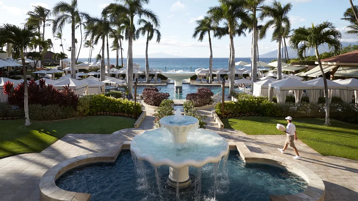 Four Seasons Maui fountain courtyard and palms leading to Wailea Beach