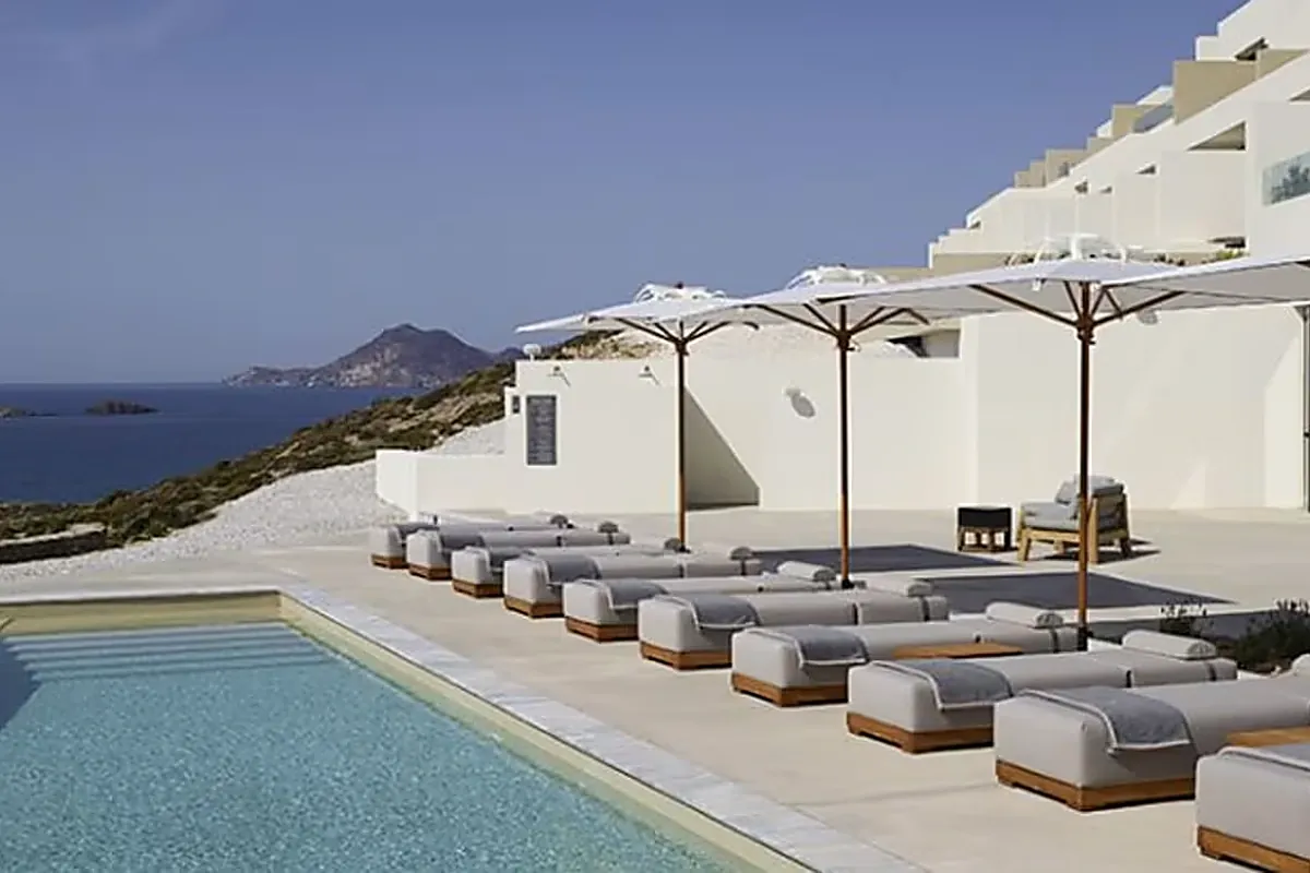 White suites with private plunge pools stepping down to the sea on Milos