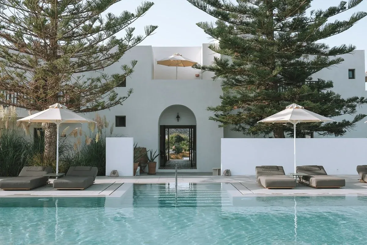 Courtyard pool and pale stone architecture at a design hotel on Paros