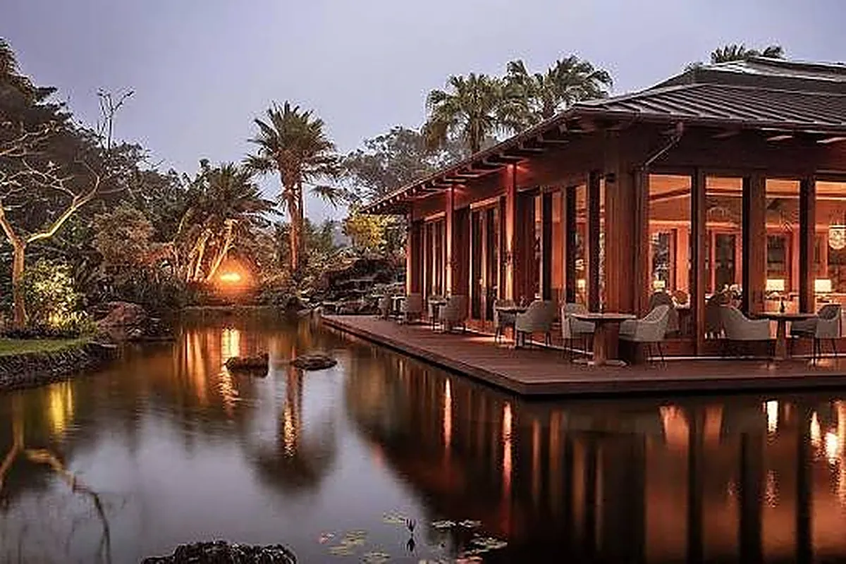 Luxury resort on red rock cliffs above a calm bay on the Hawaiian island of Lanai